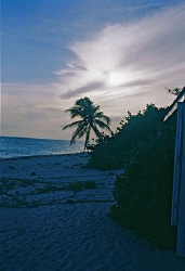 Sunset on the West side of Grand Cayman, about a mile sou... by Mordechai Saxon 